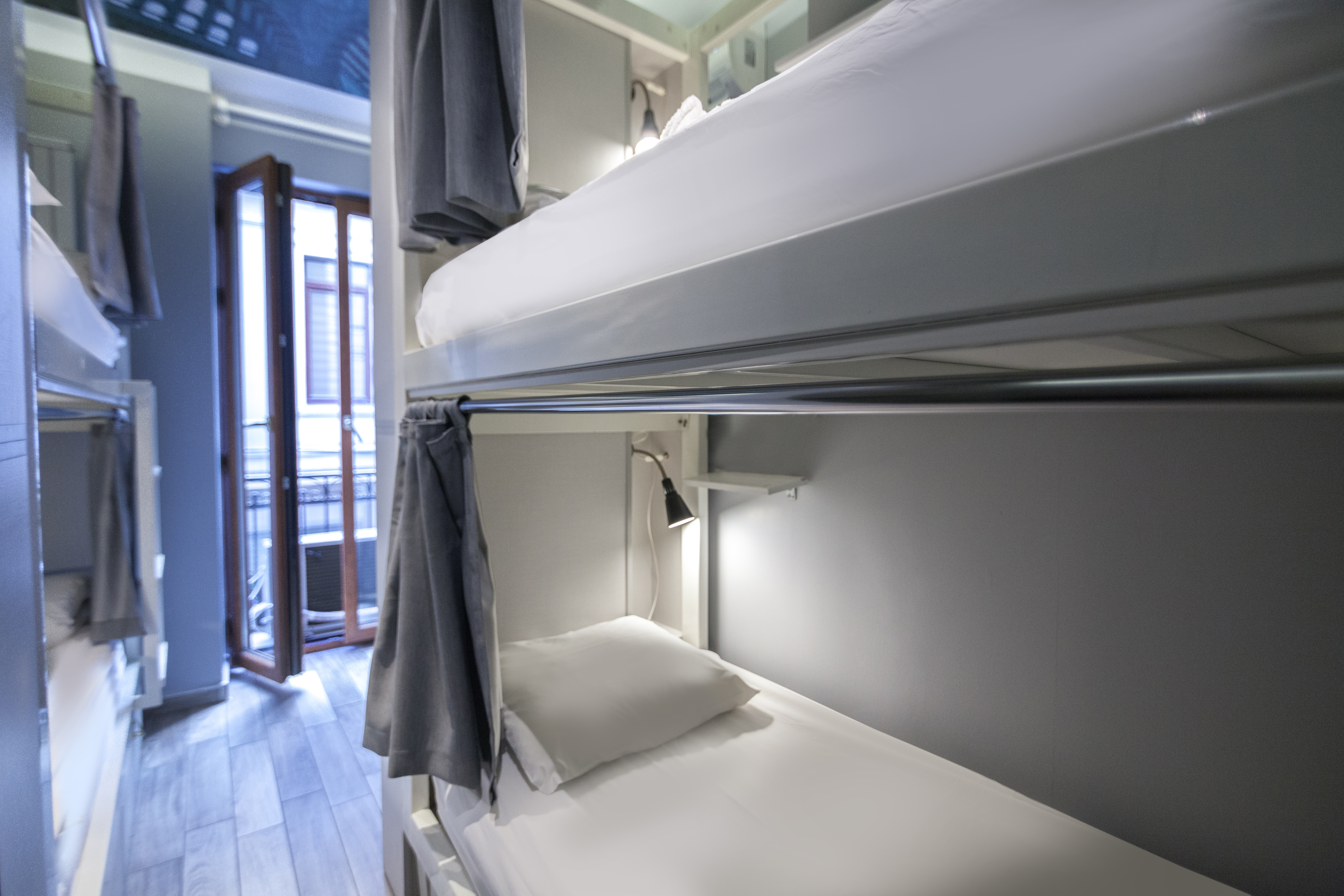 Curtains of the bunk beds for each guest.